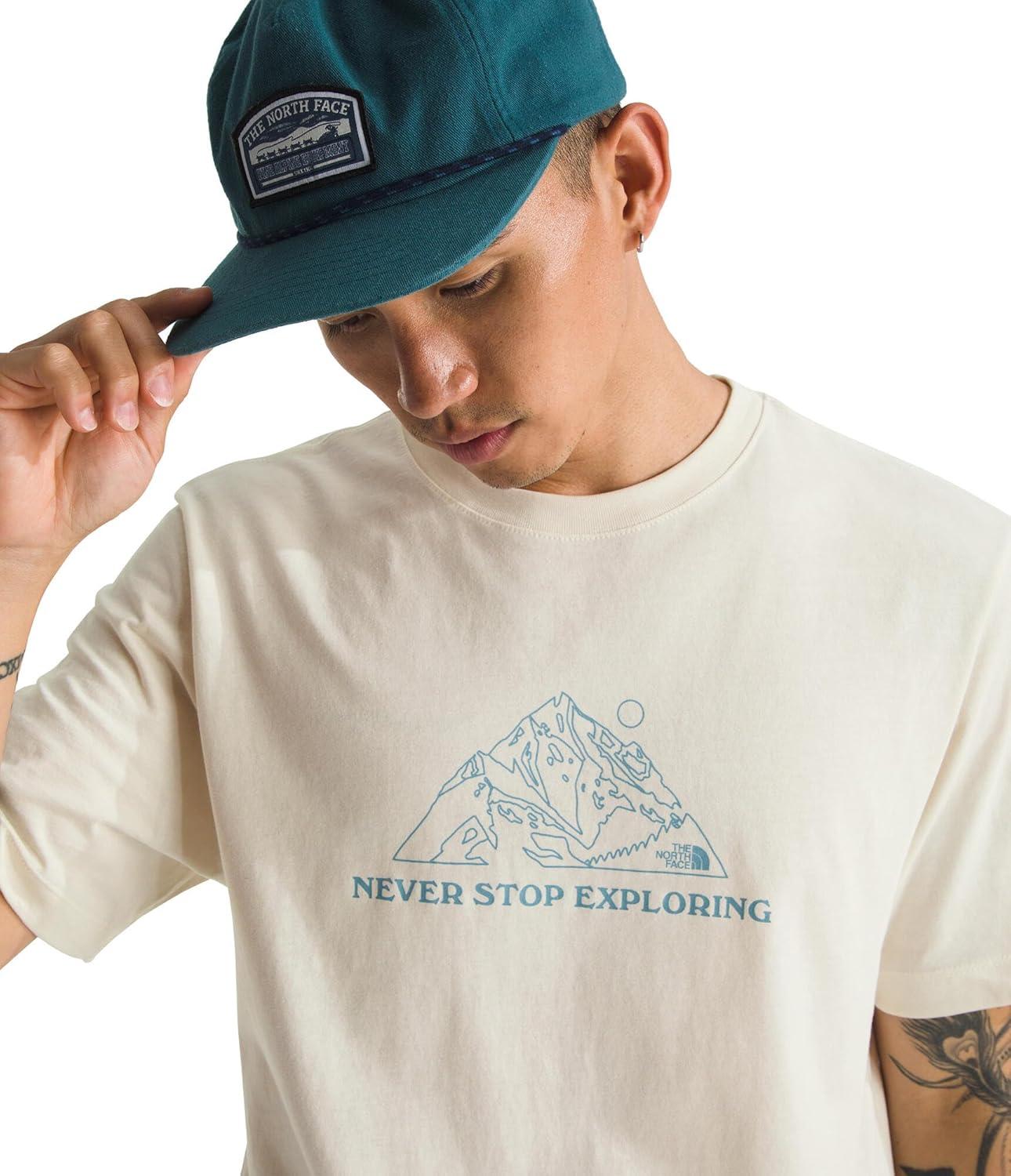 imageThe North Face Mens Evolution MTN Base ShortSleeve Tee Cotton Shirt with a Graphic Design Set in Sleeves Ribbed CollarWhite Dune