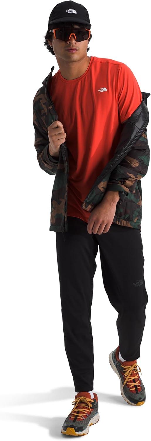 imageTHE NORTH FACE Mens Adventure Tee Lightweight amp Stretchy Shirt With Setin Sleeves amp Heat Transfer LogoCrimson Orange