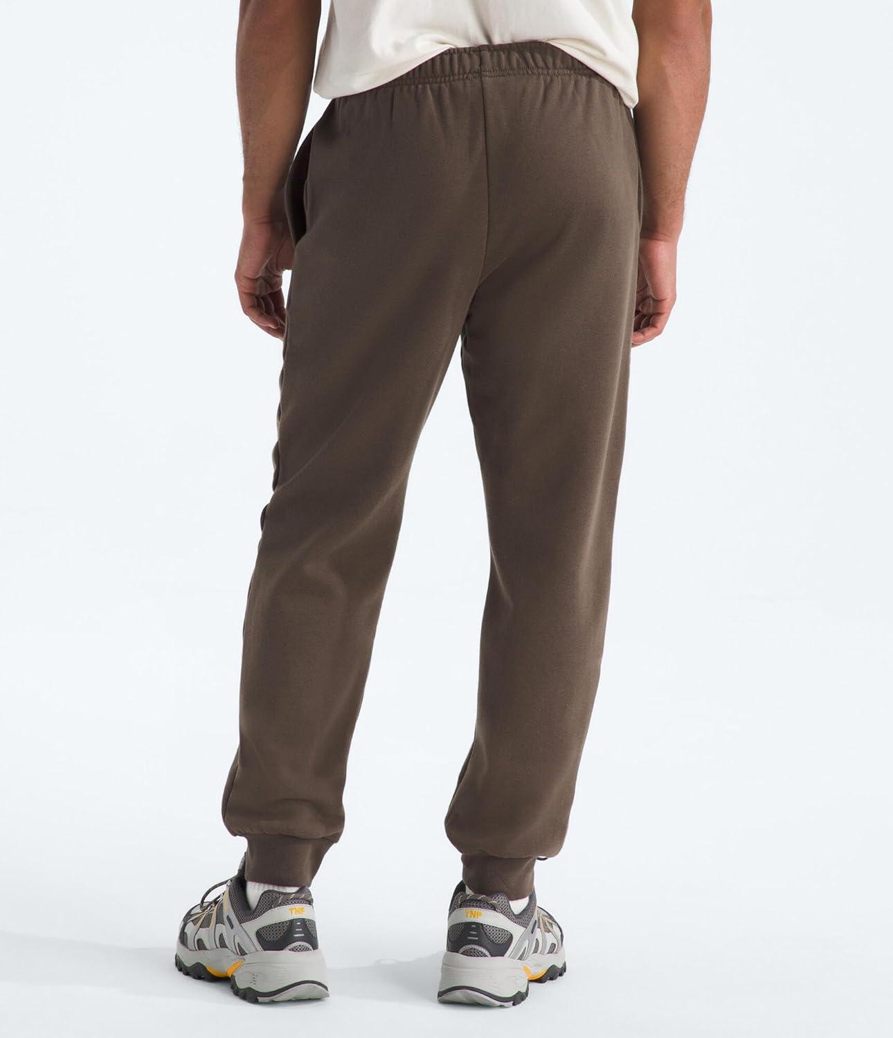 imageTHE NORTH FACE Mens Evolution Simple Dome Jogger Elastic Waistband With Adjustable Drawcord Hand Pockets Ribbed CuffsSmokey Brown