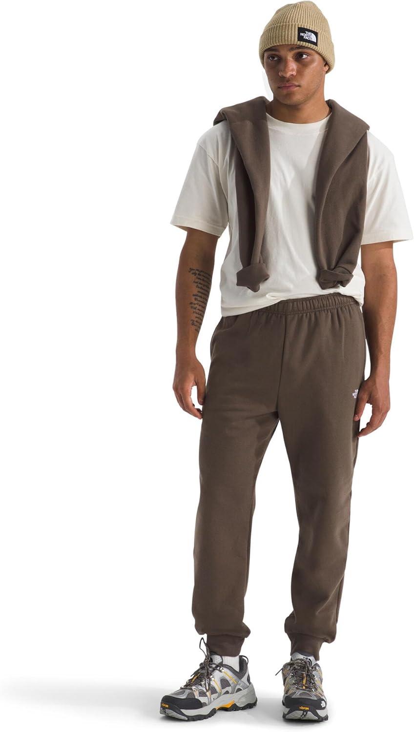 imageTHE NORTH FACE Mens Evolution Simple Dome Jogger Elastic Waistband With Adjustable Drawcord Hand Pockets Ribbed CuffsSmokey Brown