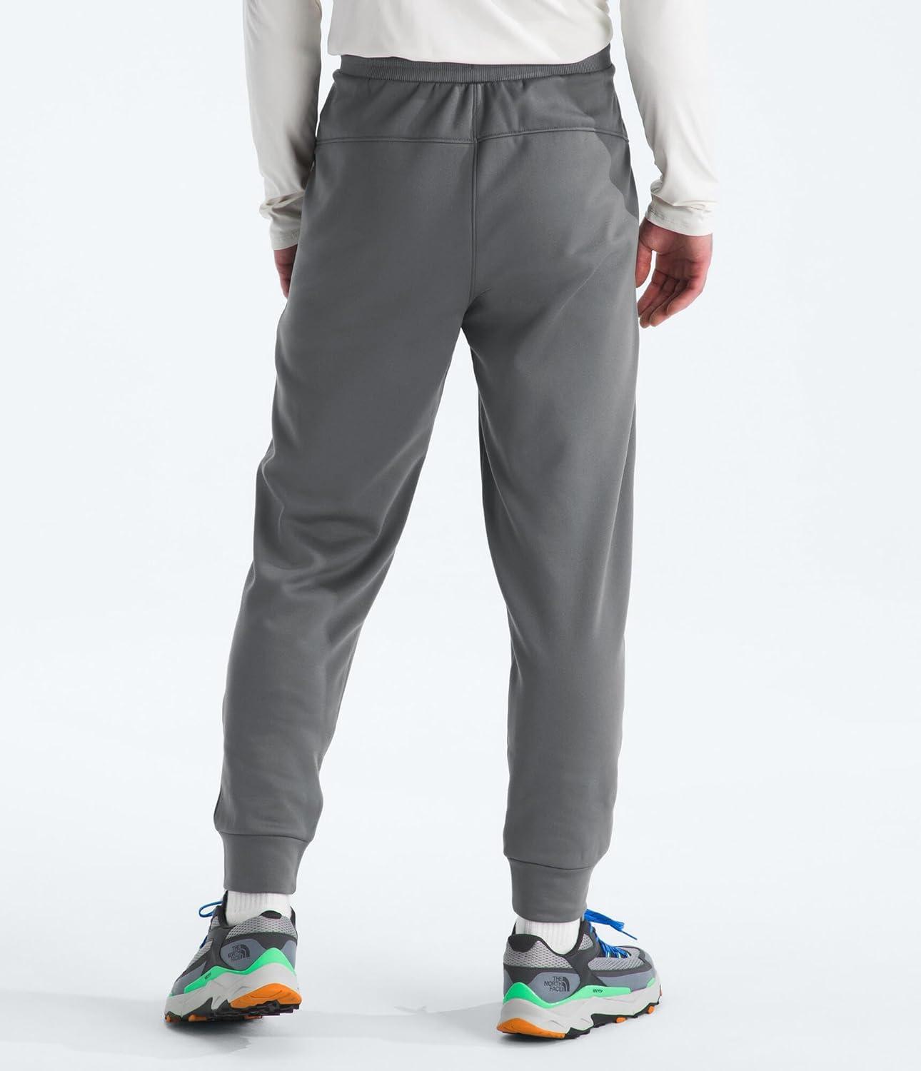 imageTHE NORTH FACE Mens TNF Performance Fleece SW Pant Internal Drawcord Ribbed Waistband amp Convenient Hand PocketsSmoked Pearl