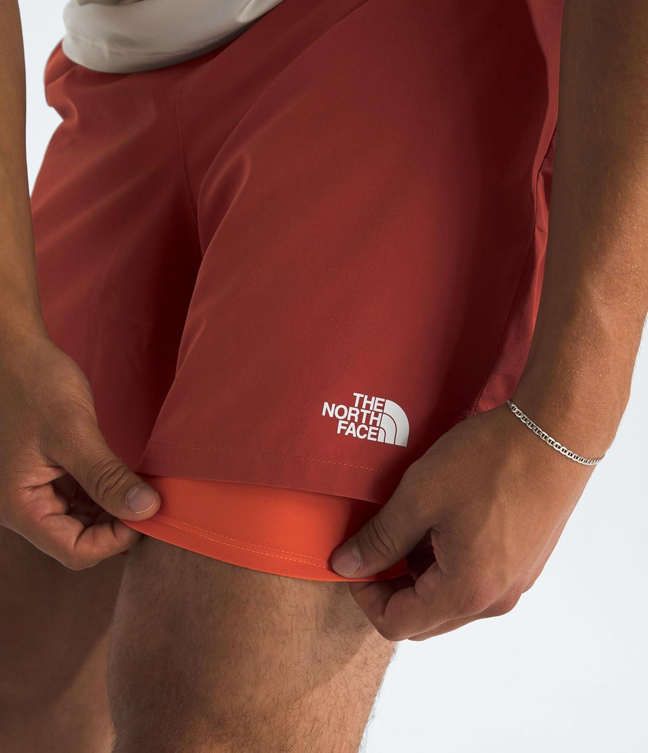 imageThe North Face Mens Wander 2in1 Short 7 Moisture Wicking Water Repellent Finish Stretch Waistband Hand PocketsIron ClayLava Red