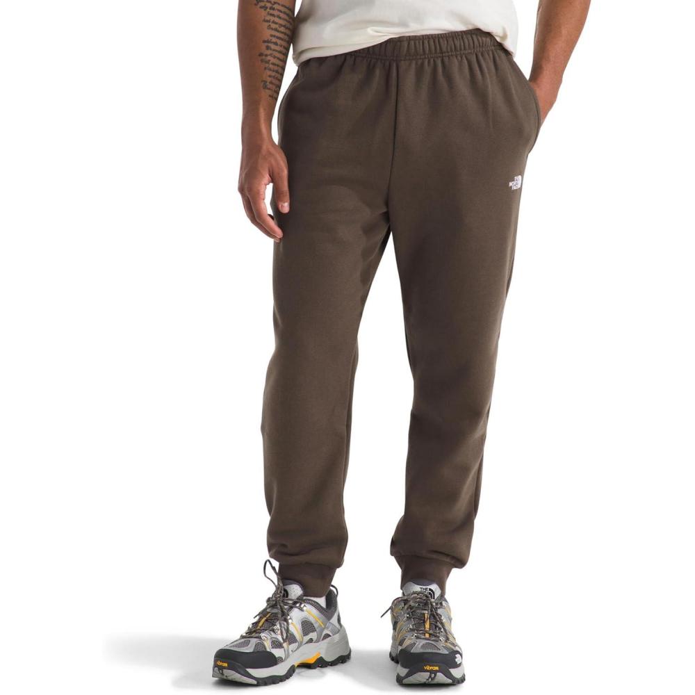 imageTHE NORTH FACE Mens Evolution Simple Dome Jogger  Elastic Waistband With Adjustable Drawcord Hand Pockets Ribbed CuffsSmokey Brown